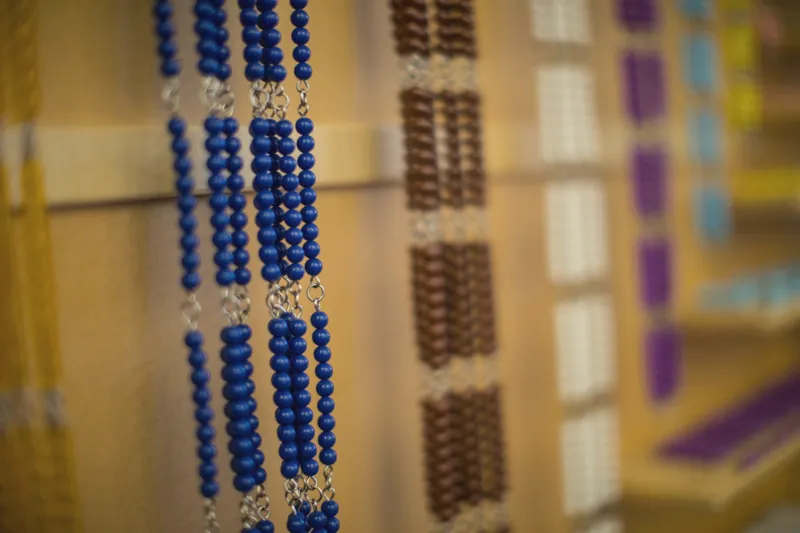 Golden bead material on a shelf