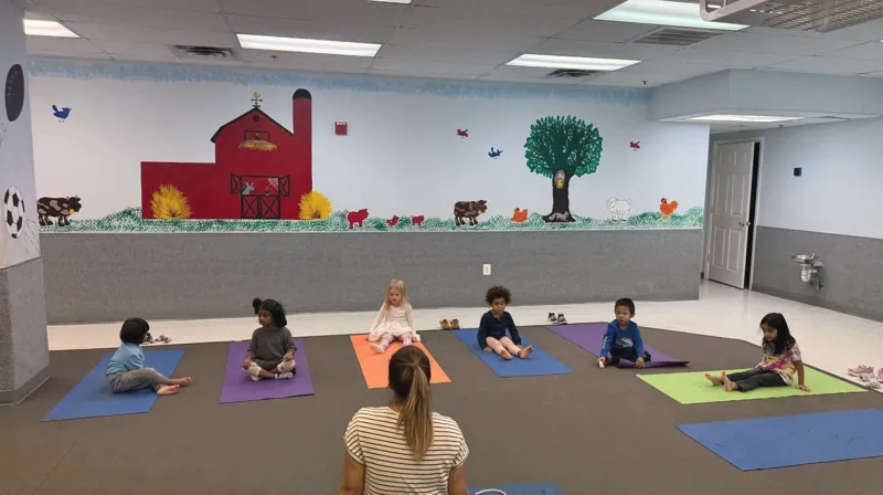Children doing yoga on mats